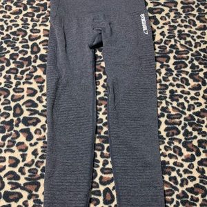 Dark grey athletic pants.